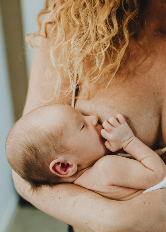Women breastfeeding her baby